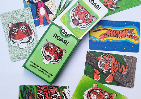 roar-card-game-allison-parkinson ROAR! card game by Allison Parkinson — box and hand-illustrated tiger cards spread out.